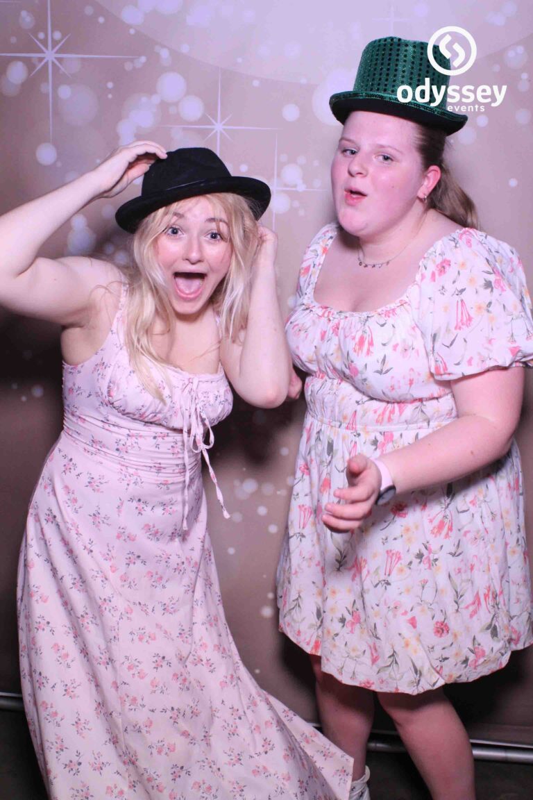 Friends using a selfie mirror photobooth at a birthday party in Kent