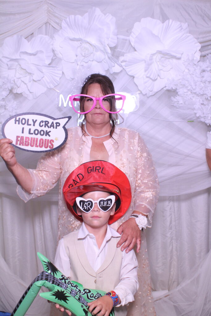 Guests queue for the photo booth at a Kent wedding