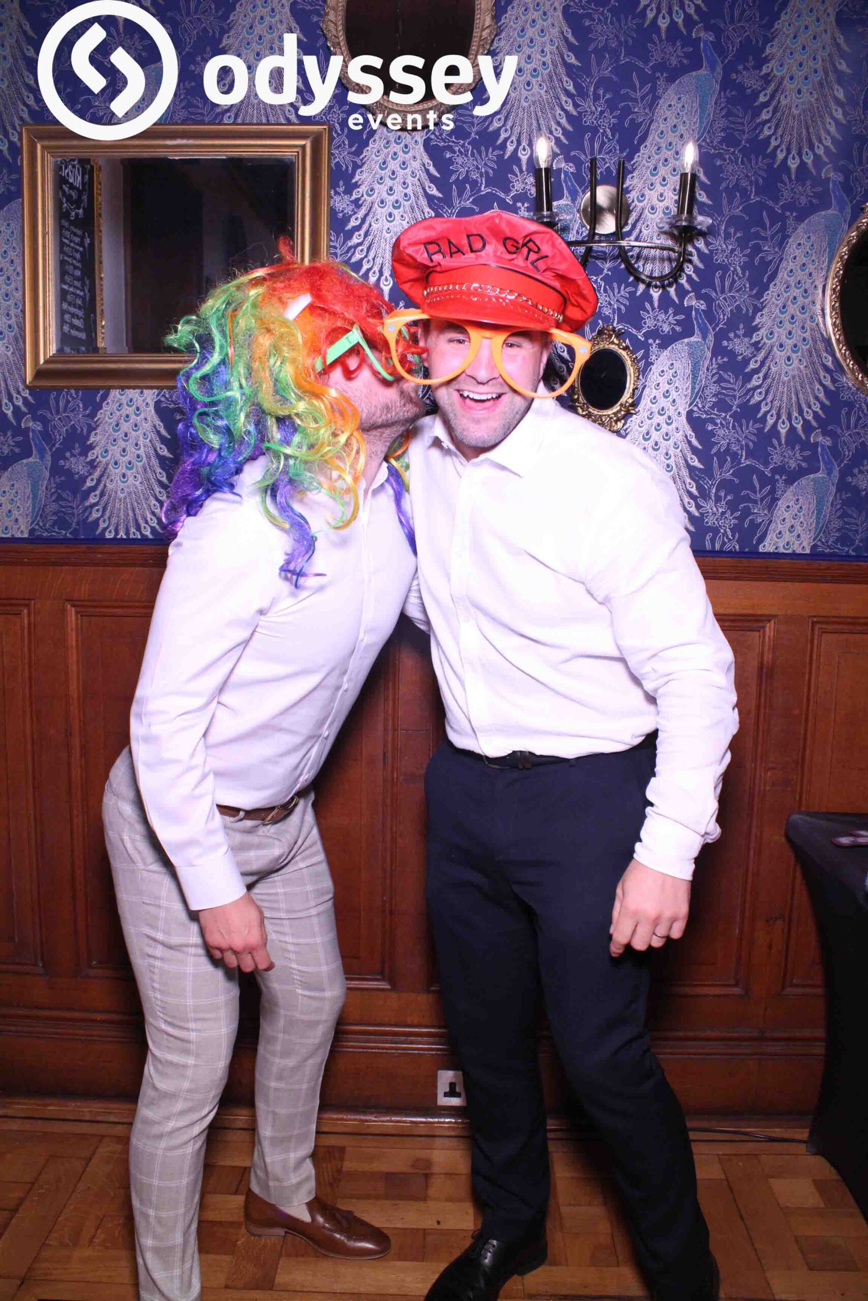 Friends laughing and posing with props at the Selfie Mirror at Salomons Estate