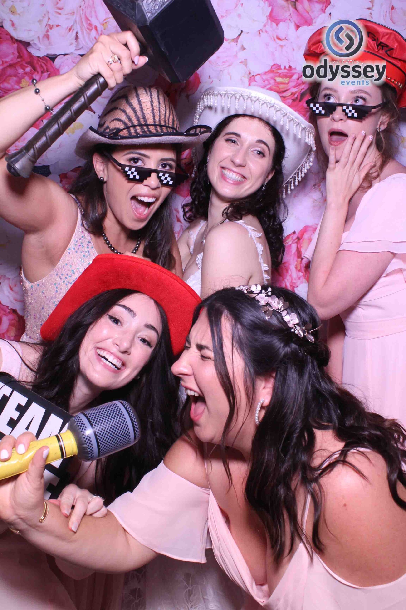 Wedding guests having fun in the Odyssey Selfie Mirror photobooth at Tunbridge Wells wedding